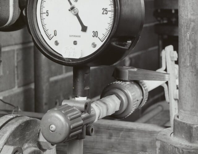 black and white photo of pipes and fittings